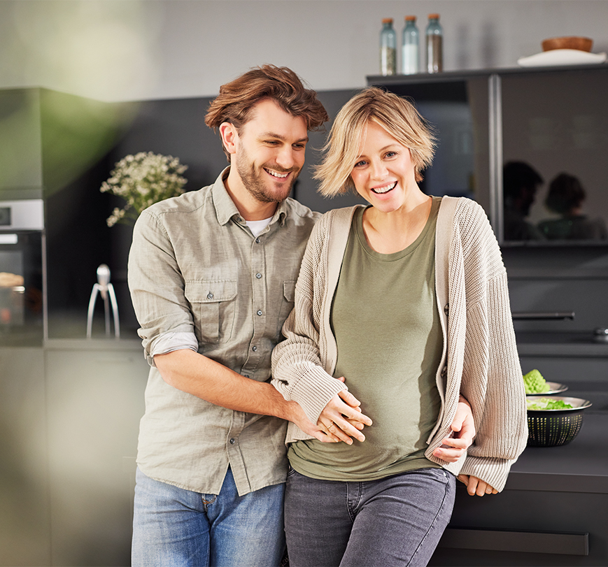 happy family, man and pregnant woman in kitchen