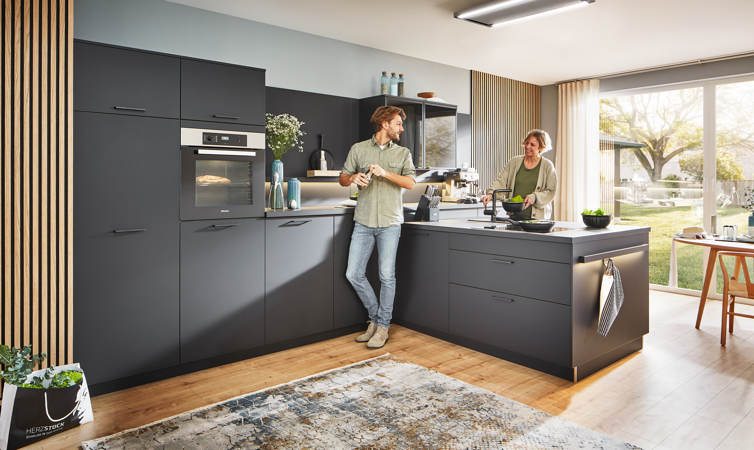 modern black kitchen with couple